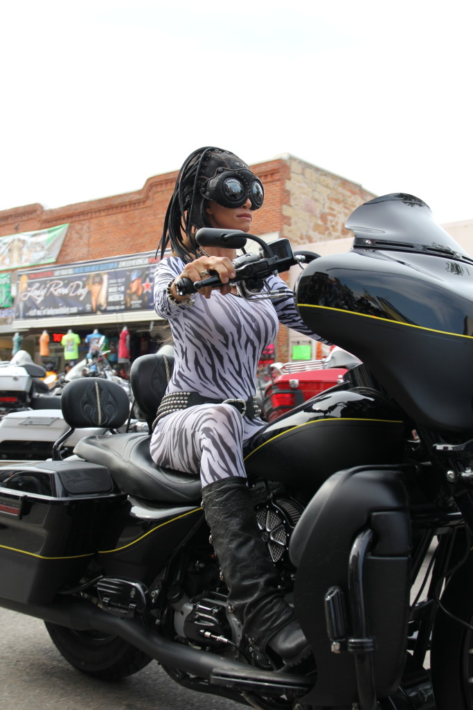 Woman in skin tight outfit on Main Street Sturgis